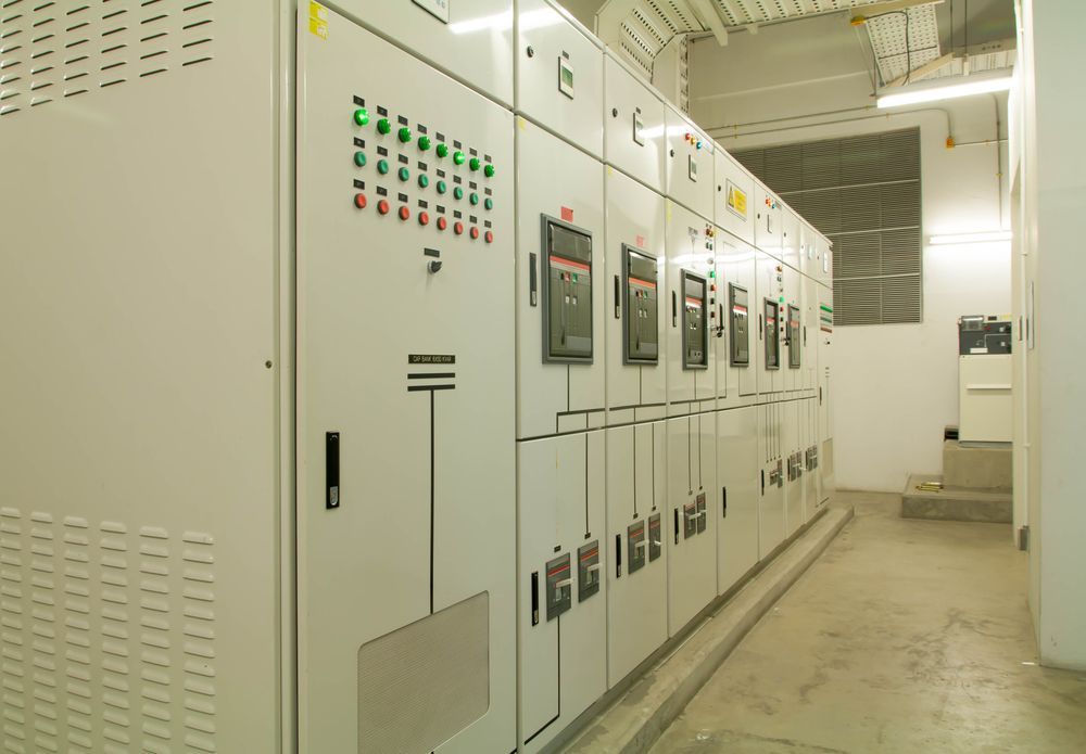 White Electrical Control Panels in A Well-Lit Utility Room — Elibon Solutions in Garbutt, QLD