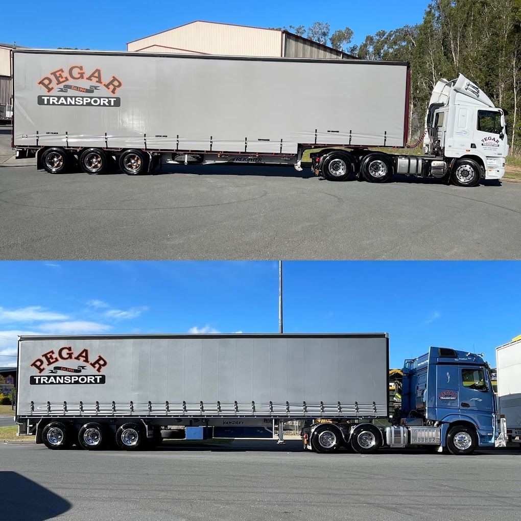 Two Trucks From Pegar Transport Are Parked Next To Each Other — Pegar Transport In Port Macquarie, NSW