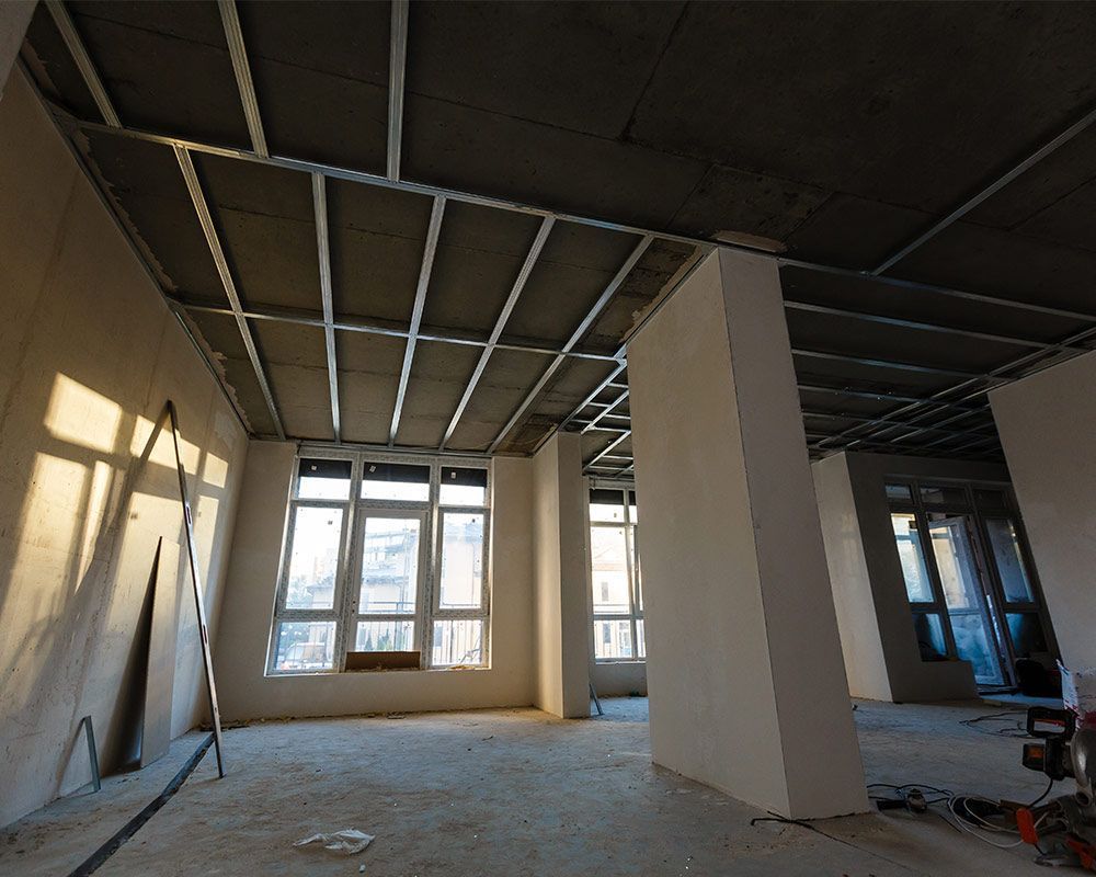 An empty room with a ceiling that is being built