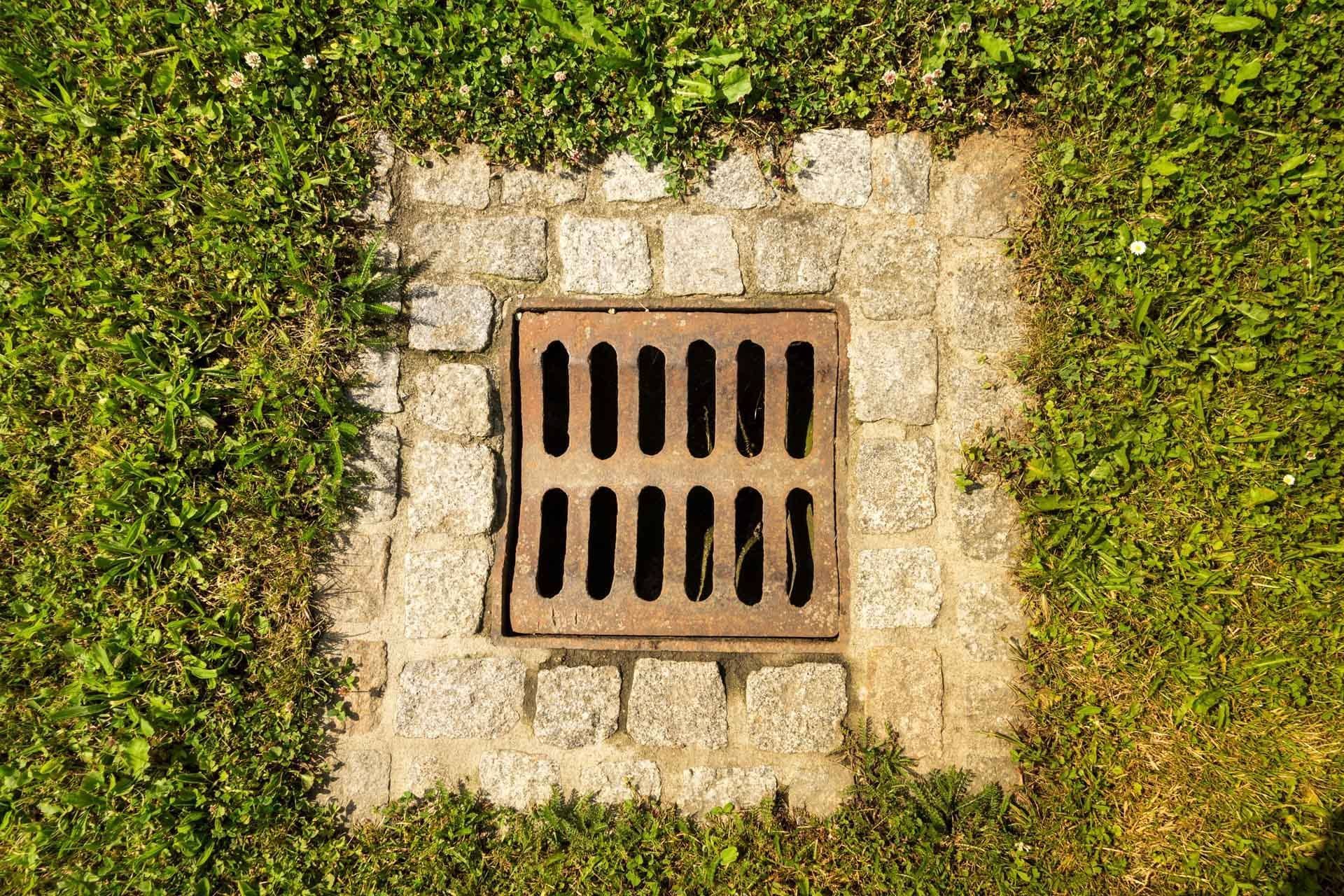 A Manhole in a Grassy Area - Tulsa, OK - Outdoor Orchestrators