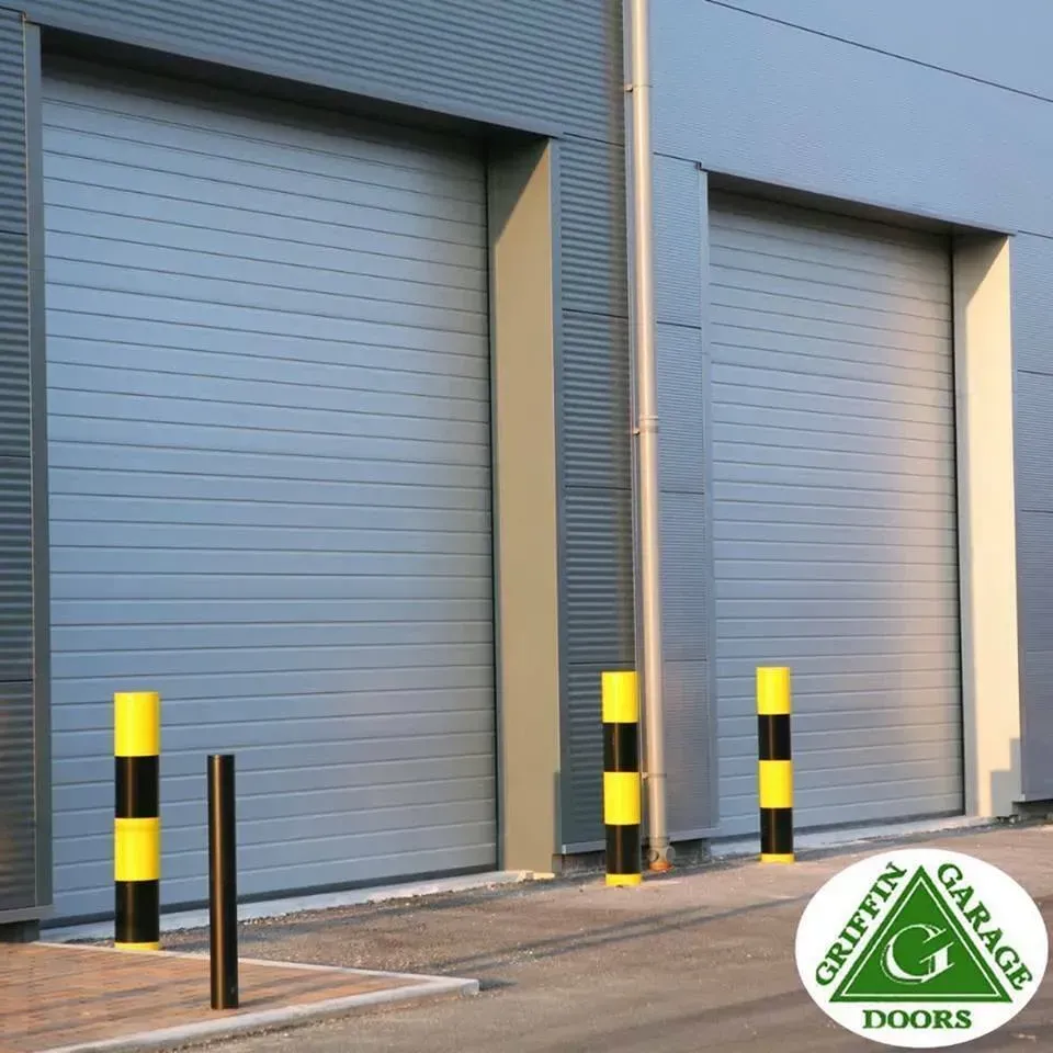 A griffin garage doors sign is on the side of a building