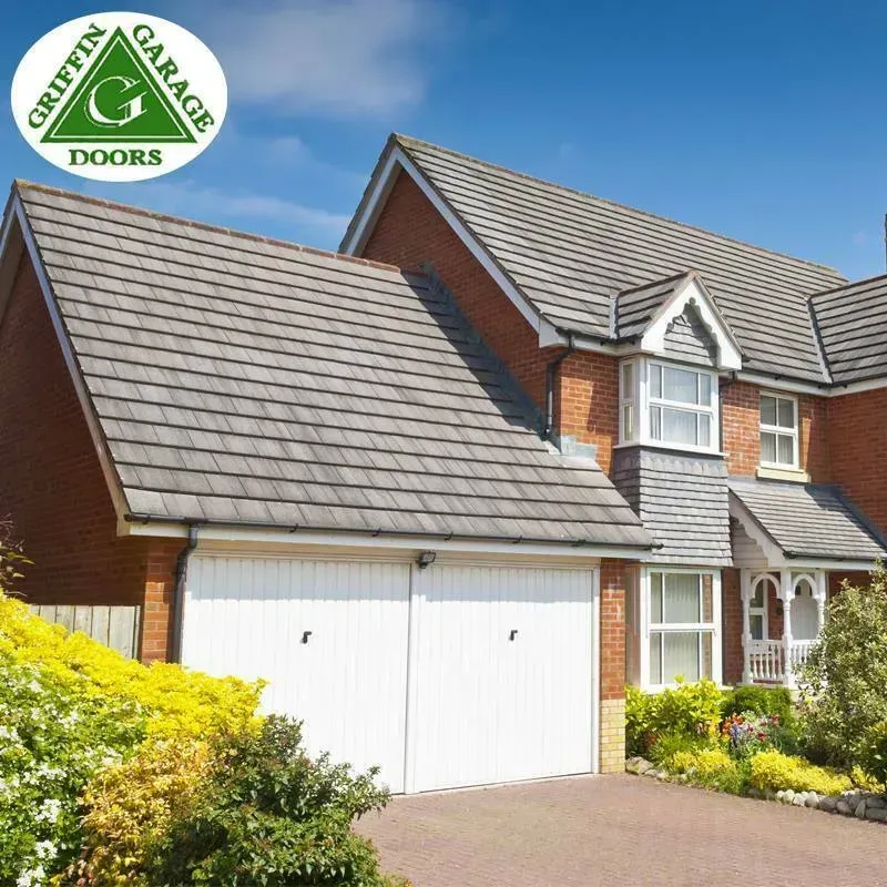 A house with a griffin garage doors logo on it