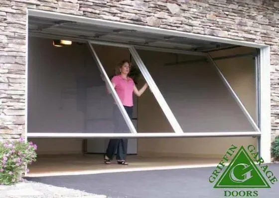 A woman in a pink shirt is standing in front of a griffin garage door