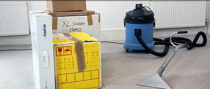 Moving in Cleans – London – All Care Cleaning – Hoover and moving boxes