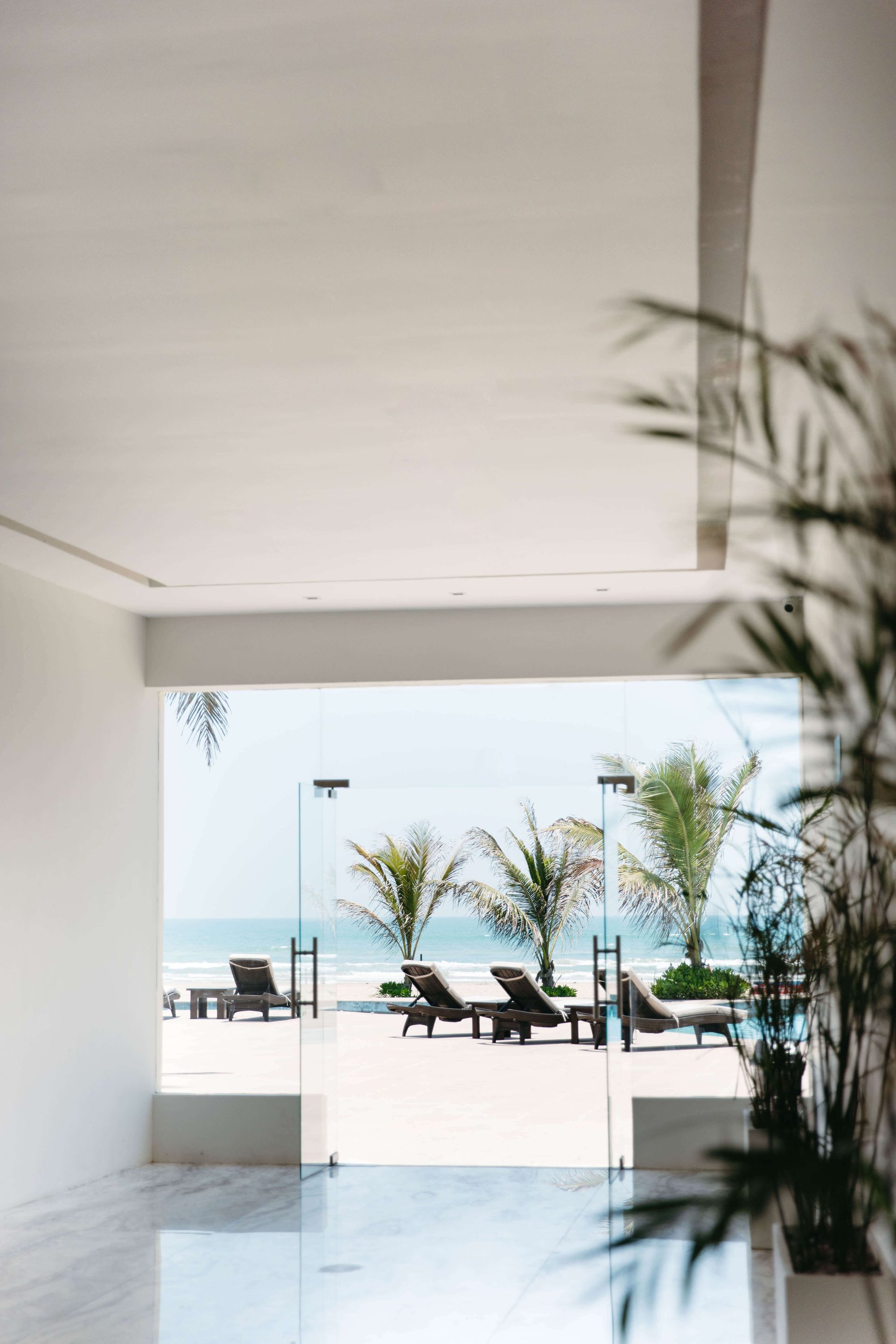 A view of the ocean from a hotel lobby.