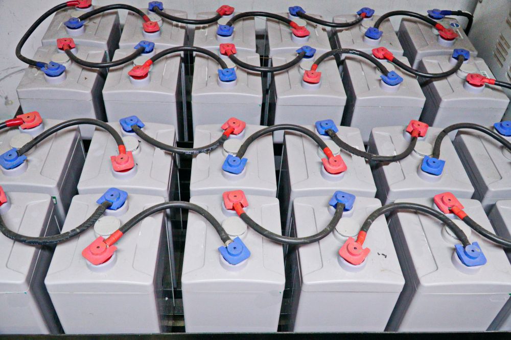 Rows of Gray Batteries With Red and Blue Terminals — Big Electrics in Redlynch, QLD