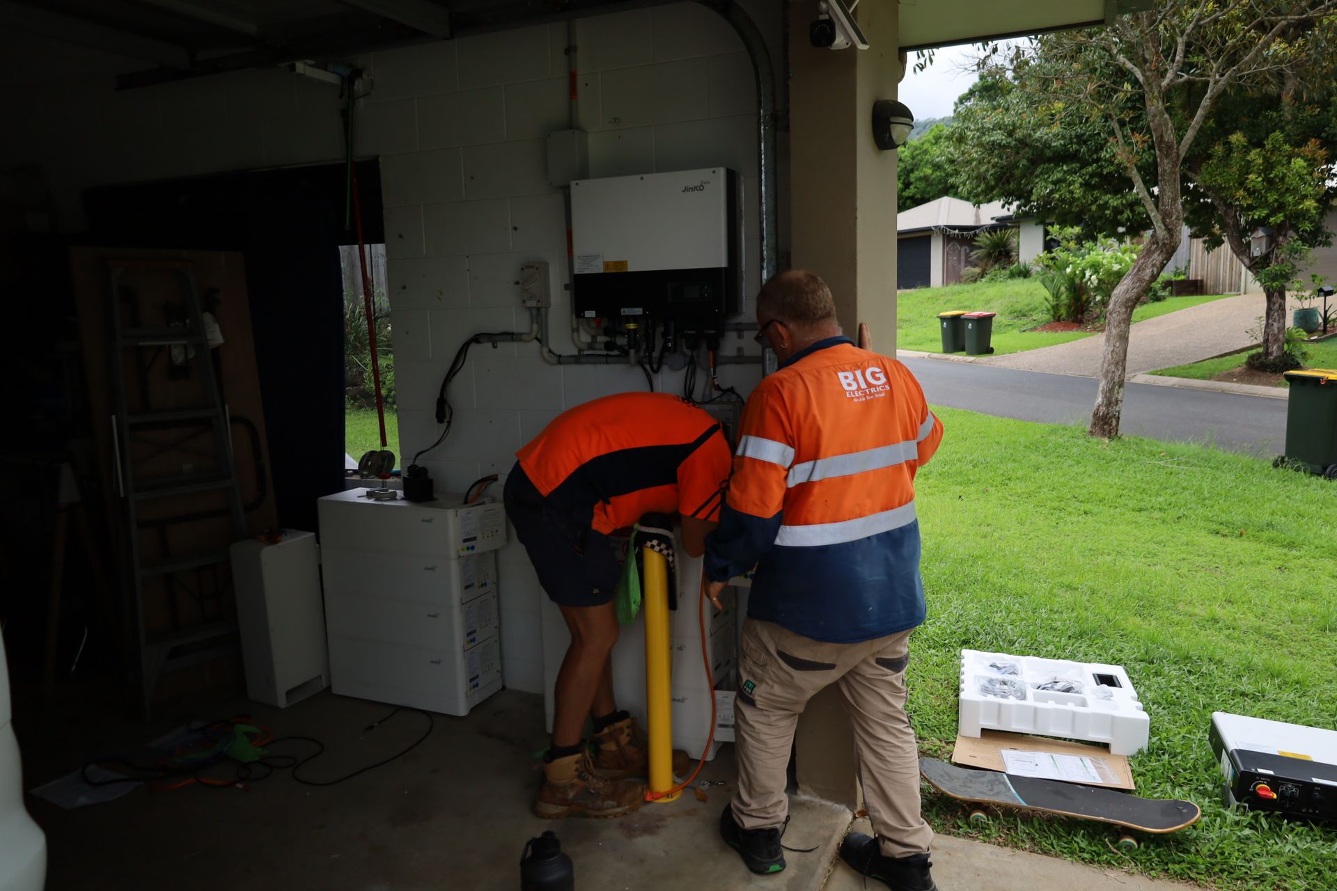 Electrician Working on Electrical Panel With Wires and Circuit Breakers — Big Electrics in Redlynch, QLD
