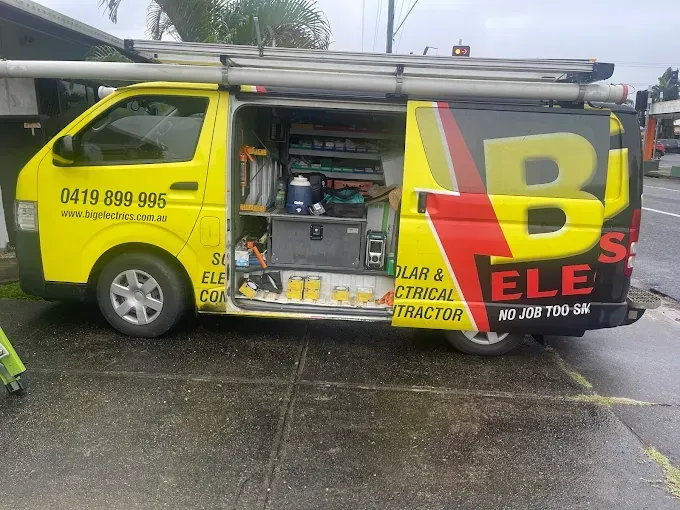 Yellow van with open side door, labeled