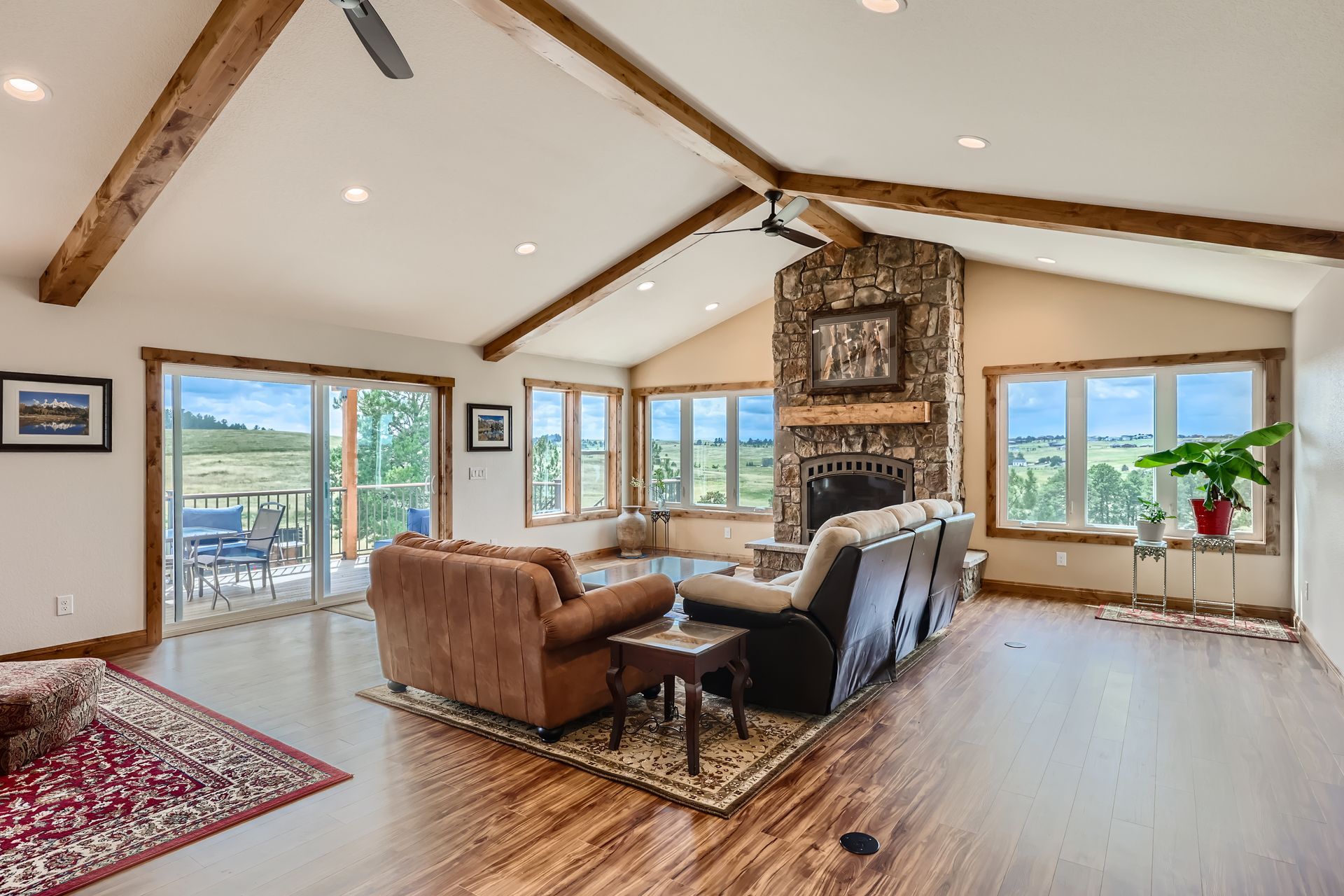 A living room filled with furniture and a fireplace.
