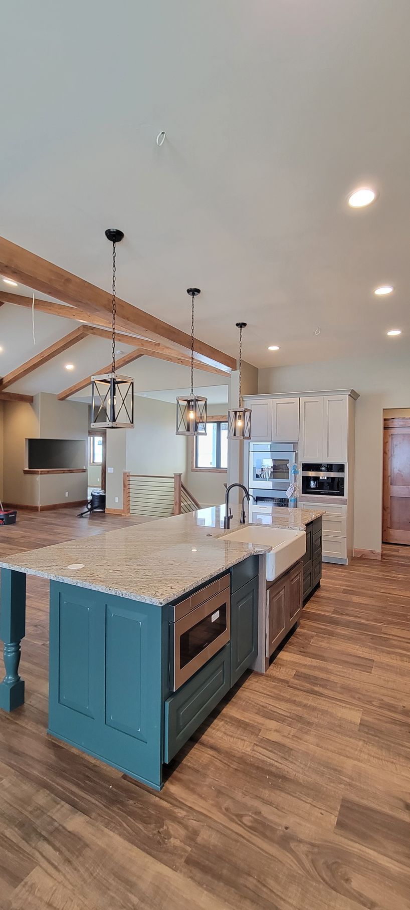 A kitchen with a large island in the middle of the room.