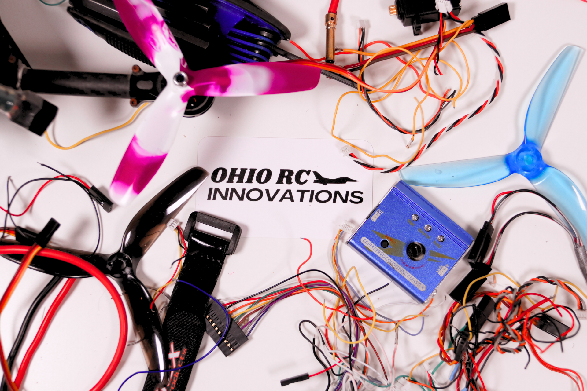 A bunch of wires are laying on a table with ohio rc innovations written on it