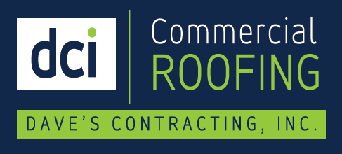 Logo for DCI Commercial Roofing, white and green text on a dark blue background. Includes the text 