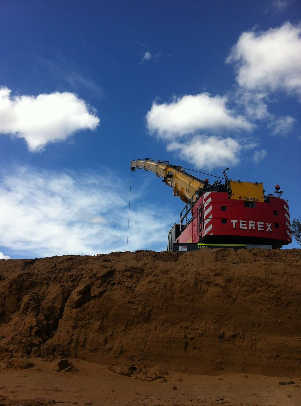 A Terex Excavator Sits On Top Of A Pile Of Dirt — SureLift Crane Hire In Collinsville, QLD