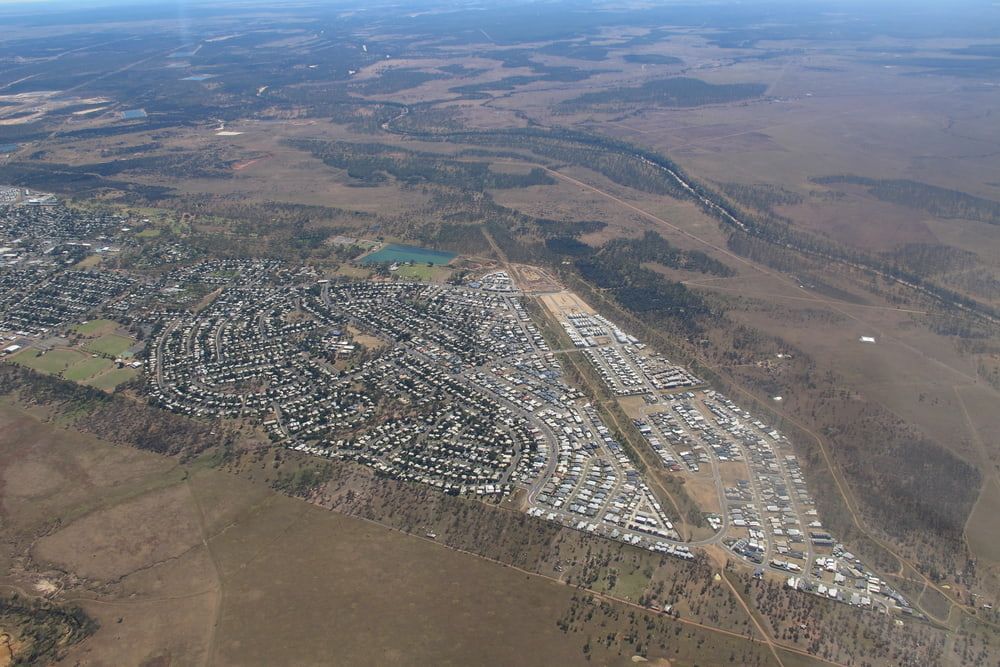 An Aerial View Of A City In The Middle Of A Desert  — SureLift Crane Hire In Moranbah, QLD
