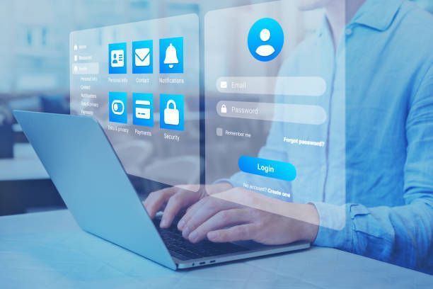 Person typing on laptop with holographic login screen and app icons, cybersecurity concept.
