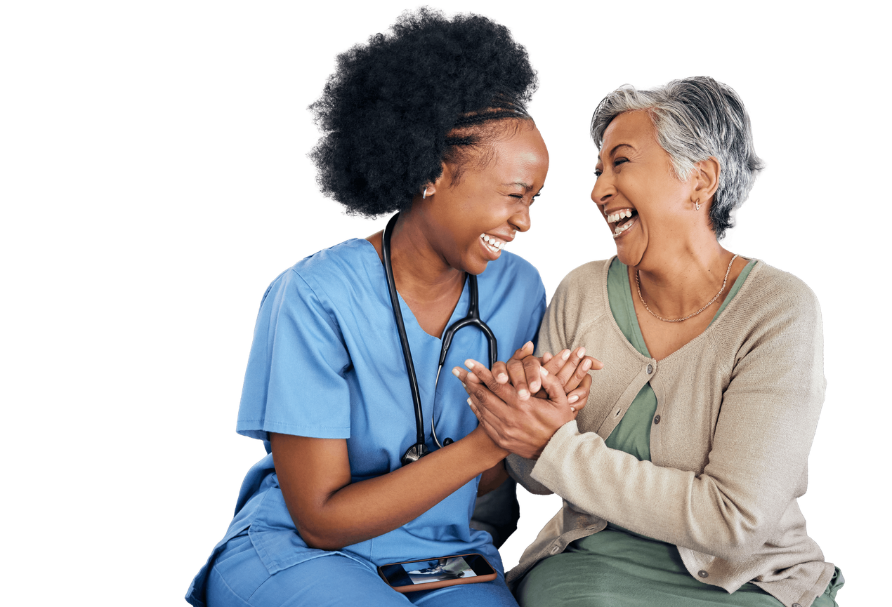 A healthcare worker in blue scrubs supports an elderly woman with a cane, both smiling A healthcare worker in blue scrubs supports an elderly woman with a cane, both smiling