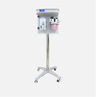 Anesthesia machine on a wheeled stand, white and silver, with gauges and breathing apparatus.