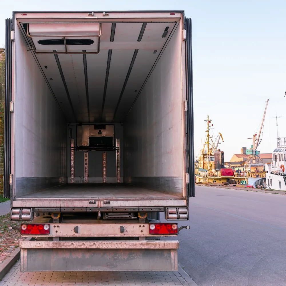 Empty Refrigerated Semi-trailer at a Dock — Hines Refrigerated Transport Pty Ltd in Maitland, NSW