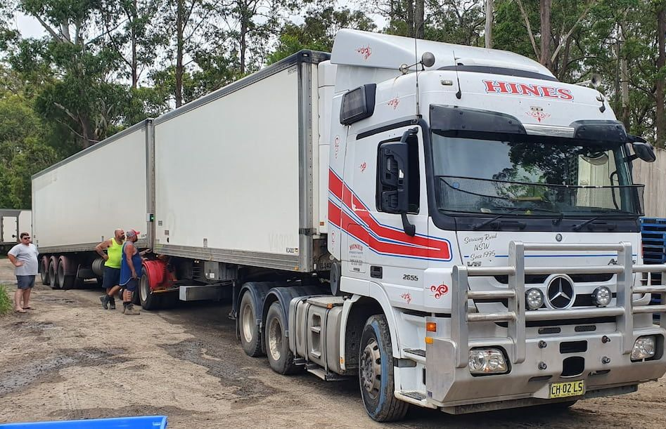 White Truck With Red Accents — Hines Refrigerated Transport Pty Ltd in Kundabung, NSW