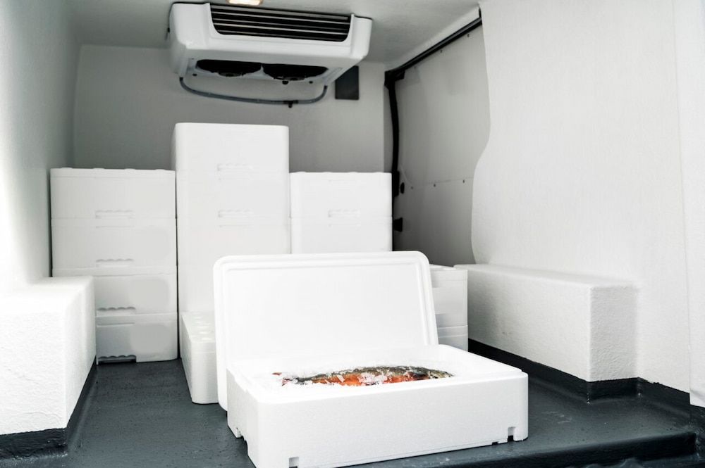 Interior of a Refrigerated Truck With Boxes of Fish — Hines Refrigerated Transport Pty Ltd in Kundabung, NSW