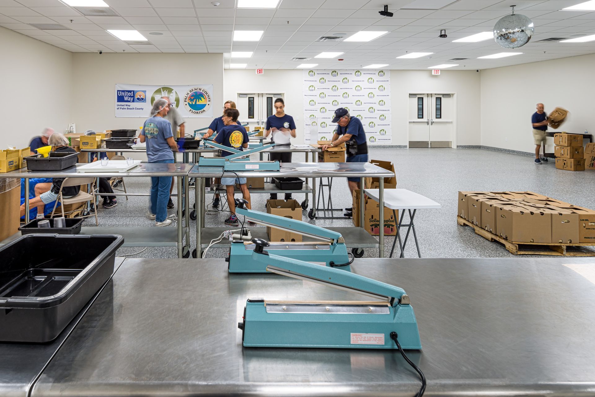 A large warehouse filled with lots of shelves and boxes.