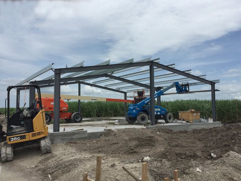 A construction site with a forklift and a crane.