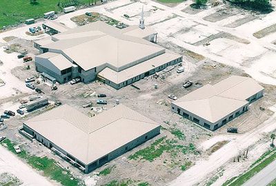 An aerial view of a large building under construction