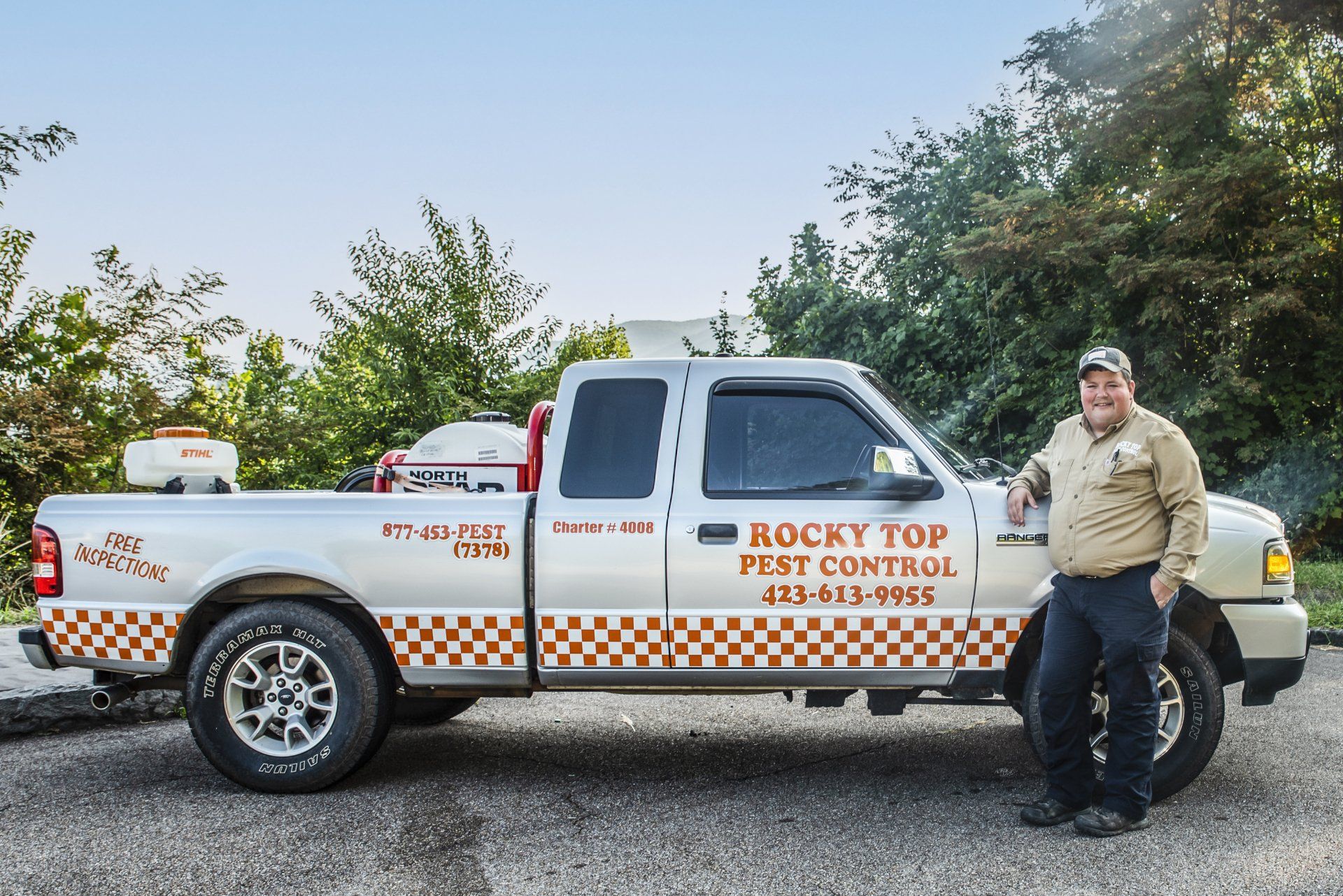 Man Standing Beside The Company Car —  Newport, TN — Rocky Top Pest Control