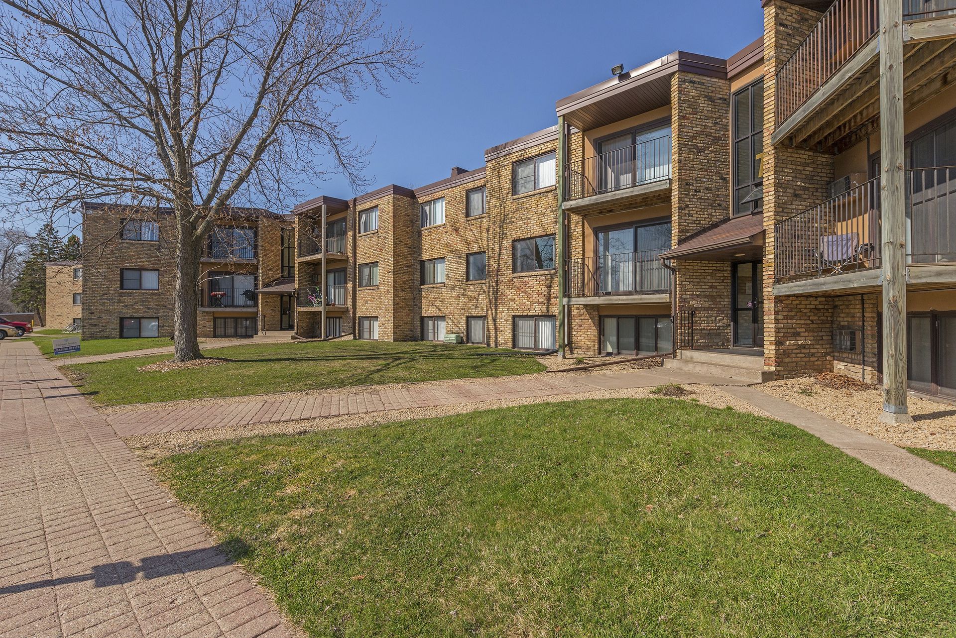 A large apartment building with a lot of windows and balconies.