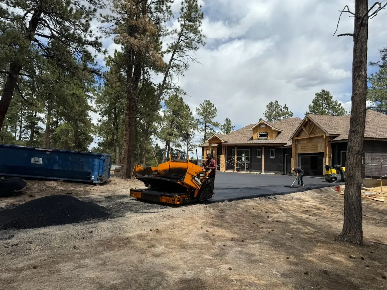A large house is being built in the middle of a forest.