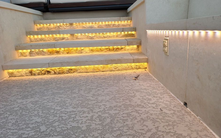 A set of stairs with lights on the side of them