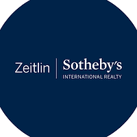 The logo for sotheby 's international realty is in a blue circle.