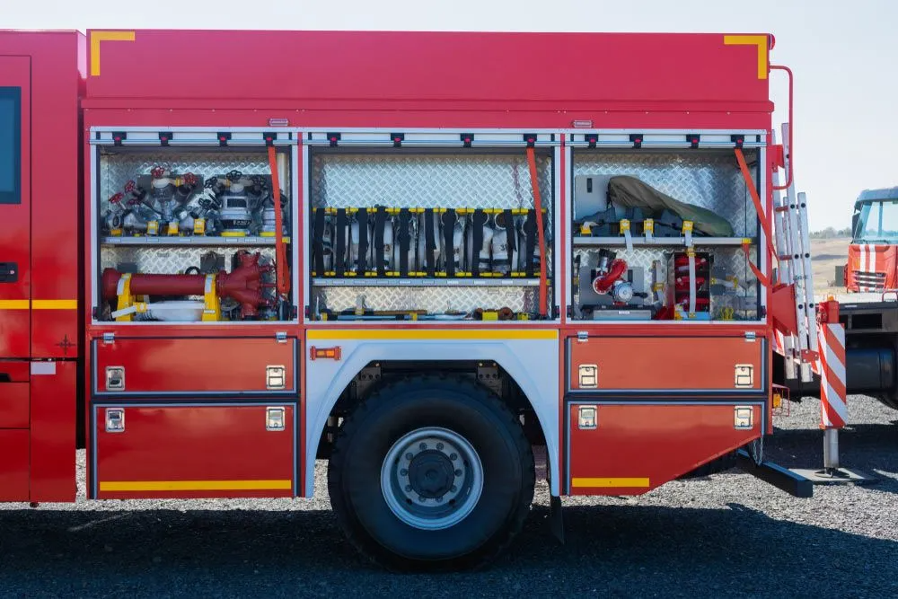 A Red Fire Truck is Parked on the Side of the Road — Truck Training and Assessments In Umina Beach, NSW