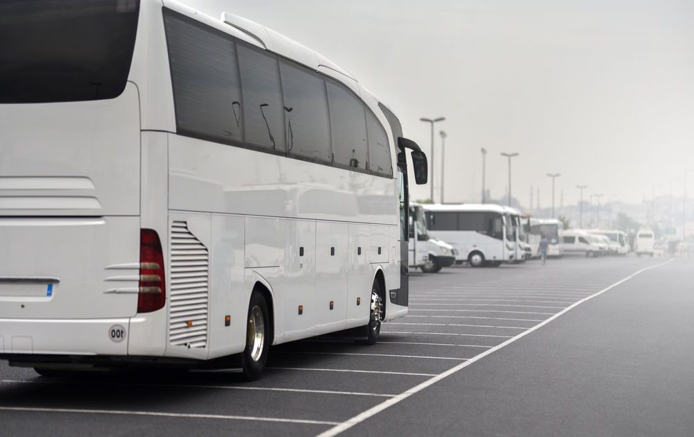 A White Bus is Parked in a Parking Lot — Truck Training and Assessments In Umina Beach, NSW