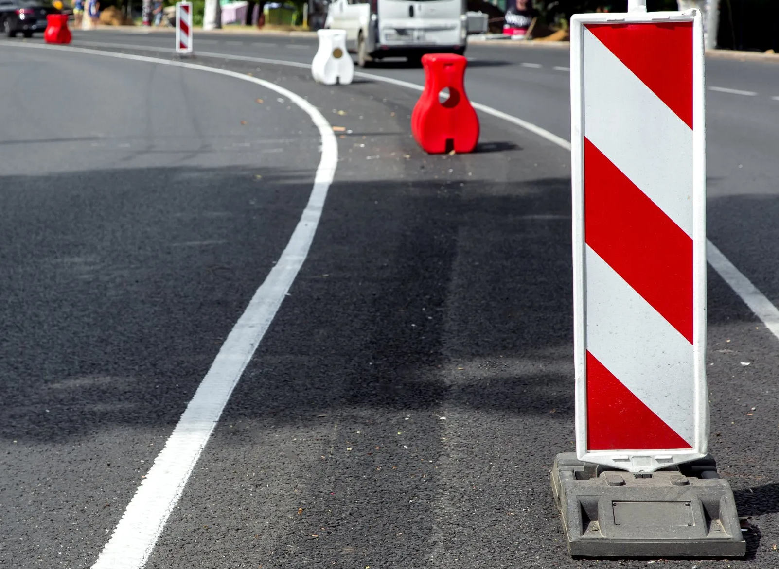 A Red and White Striped Sign on the Side of a Road — Truck Training and Assessments In Umina Beach, NSW
