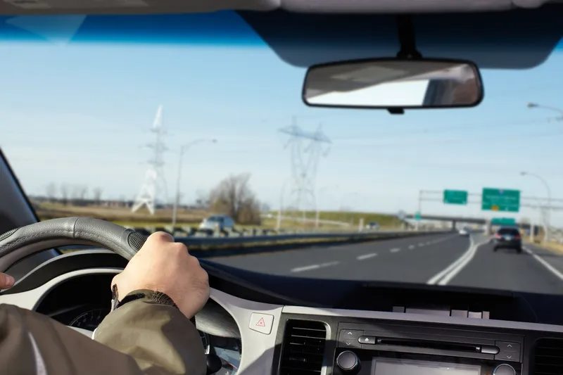 A Person is Driving a Car on a Highway — Truck Training and Assessments In Umina Beach, NSW