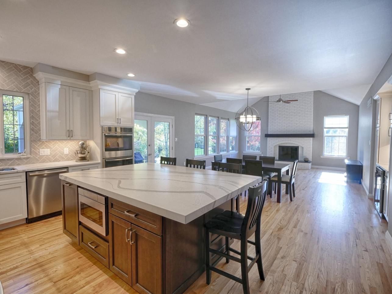 There is a large island in the middle of the kitchen.