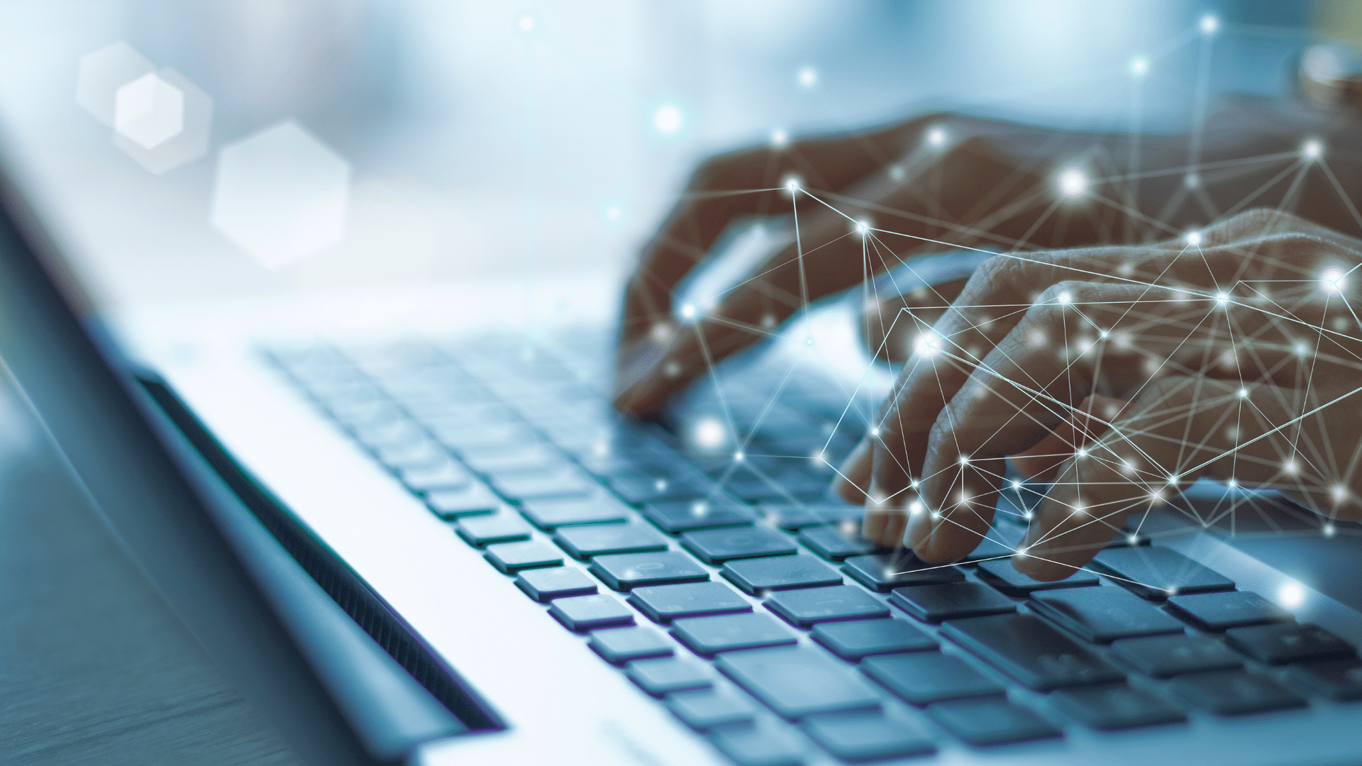 Hands typing on a laptop keyboard, with glowing network connections overlaid on the image.