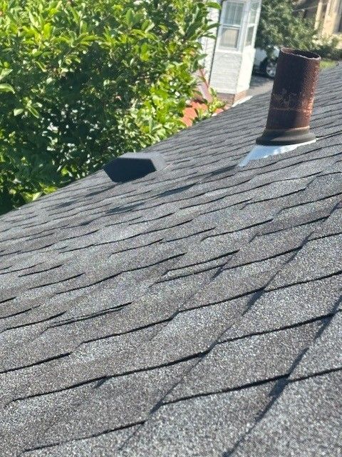 Linwood, New Jersey home with asphalt shingle roof with chimney and vent
