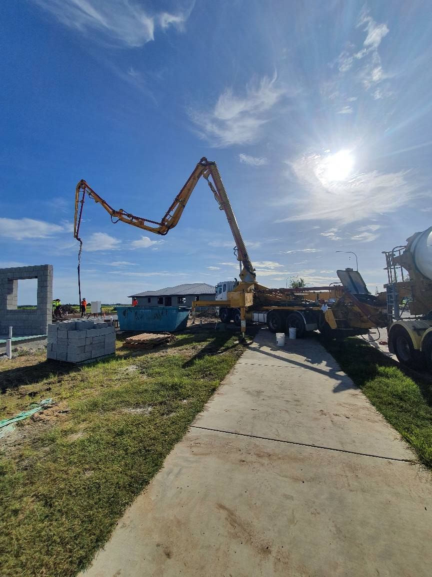 A Concrete Pump is Being Used to Pour Concrete on a Sidewalk — Polley's Concrete Pumping in Rural View, QLD