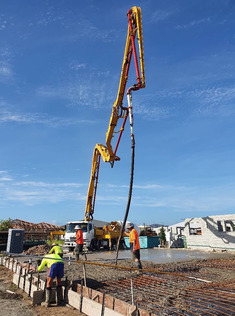 A Concrete Pump is Being Used on a Construction Site — Polley's Concrete Pumping in Rural View, QLD