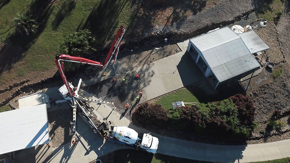 An Aerial View of a Construction Site With a Concrete Pump — Polley's Concrete Pumping in Moranbah, QLD