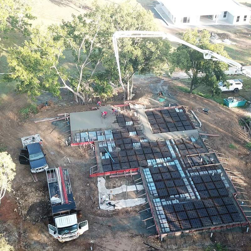 An Aerial View of a Construction Site Using a Concrete Pump — Polley's Concrete Pumping in Airlie Beach, QLD