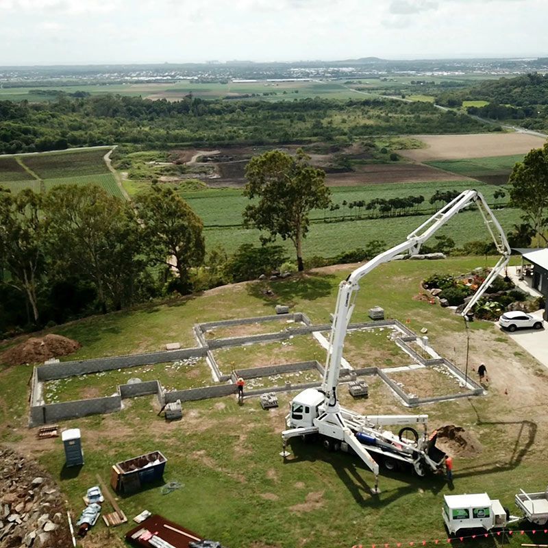 A Construction Site With a Concrete Pump — Polley's Concrete Pumping in Airlie Beach, QLD
