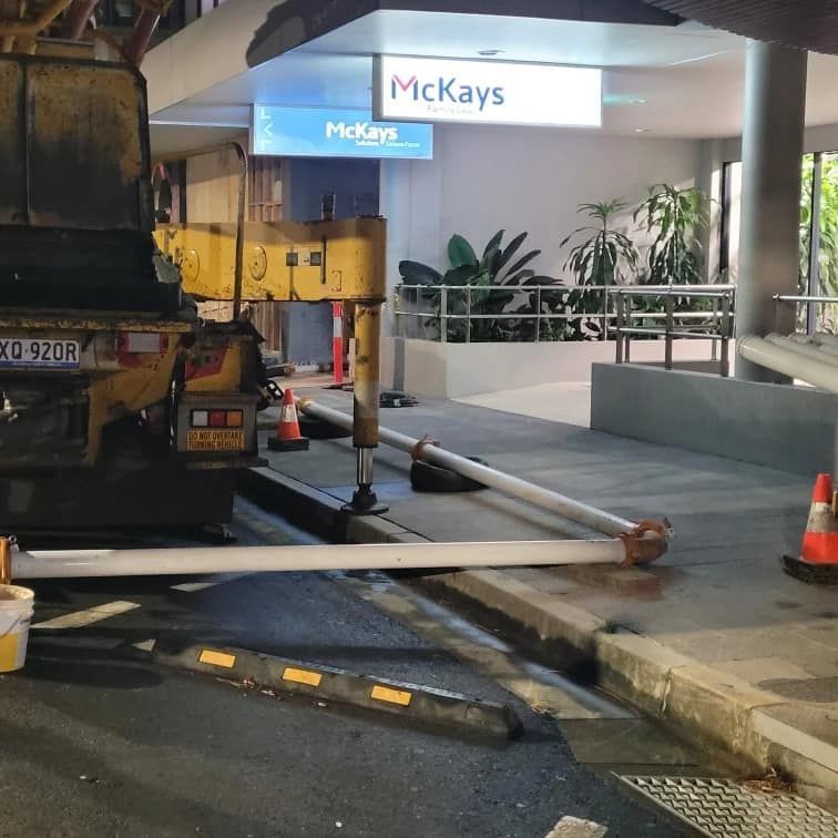 A Truck is Parked in Front of a Building — Polley's Concrete Pumping in Kuttabul, QLD