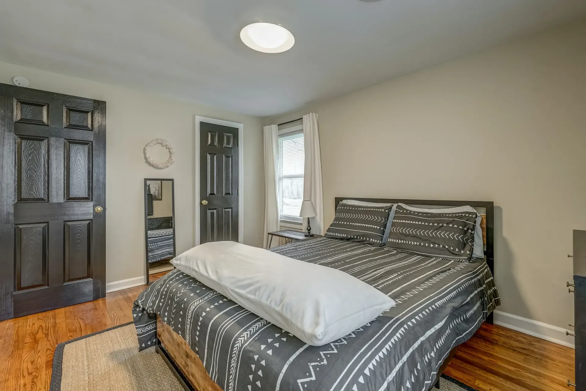 There is a large bed in the middle of the room.