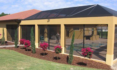 People inside pool enclosure — Leesburg, FL — Aluminum Contractors Inc