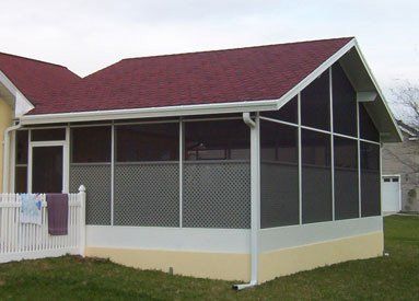 Screen room with red roof — Leesburg, FL — Aluminum Contractors Inc