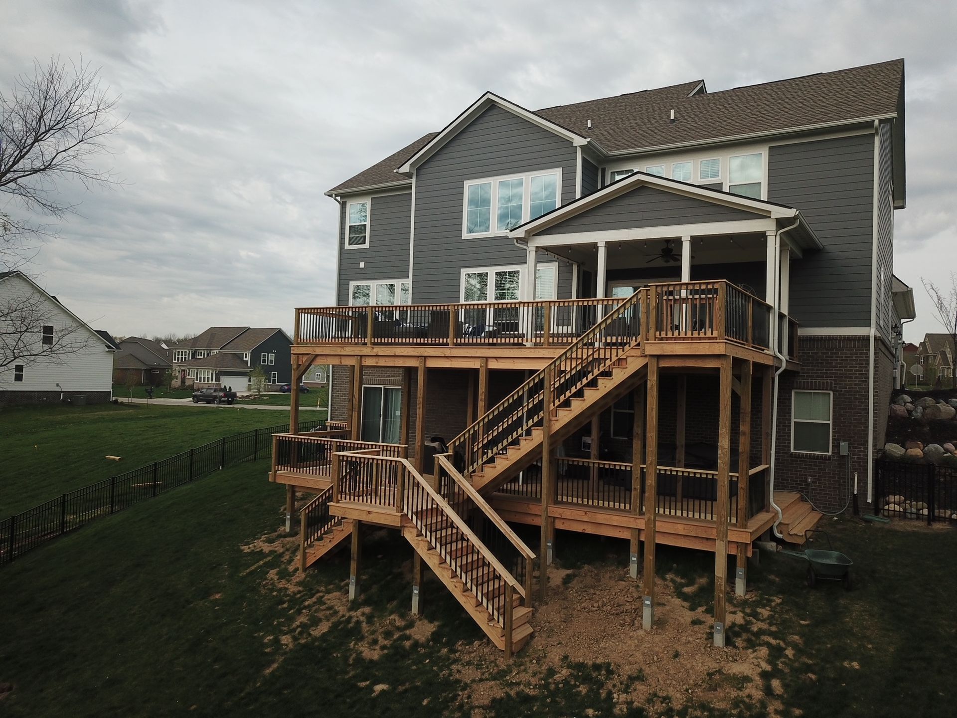 A large house with a large deck and stairs