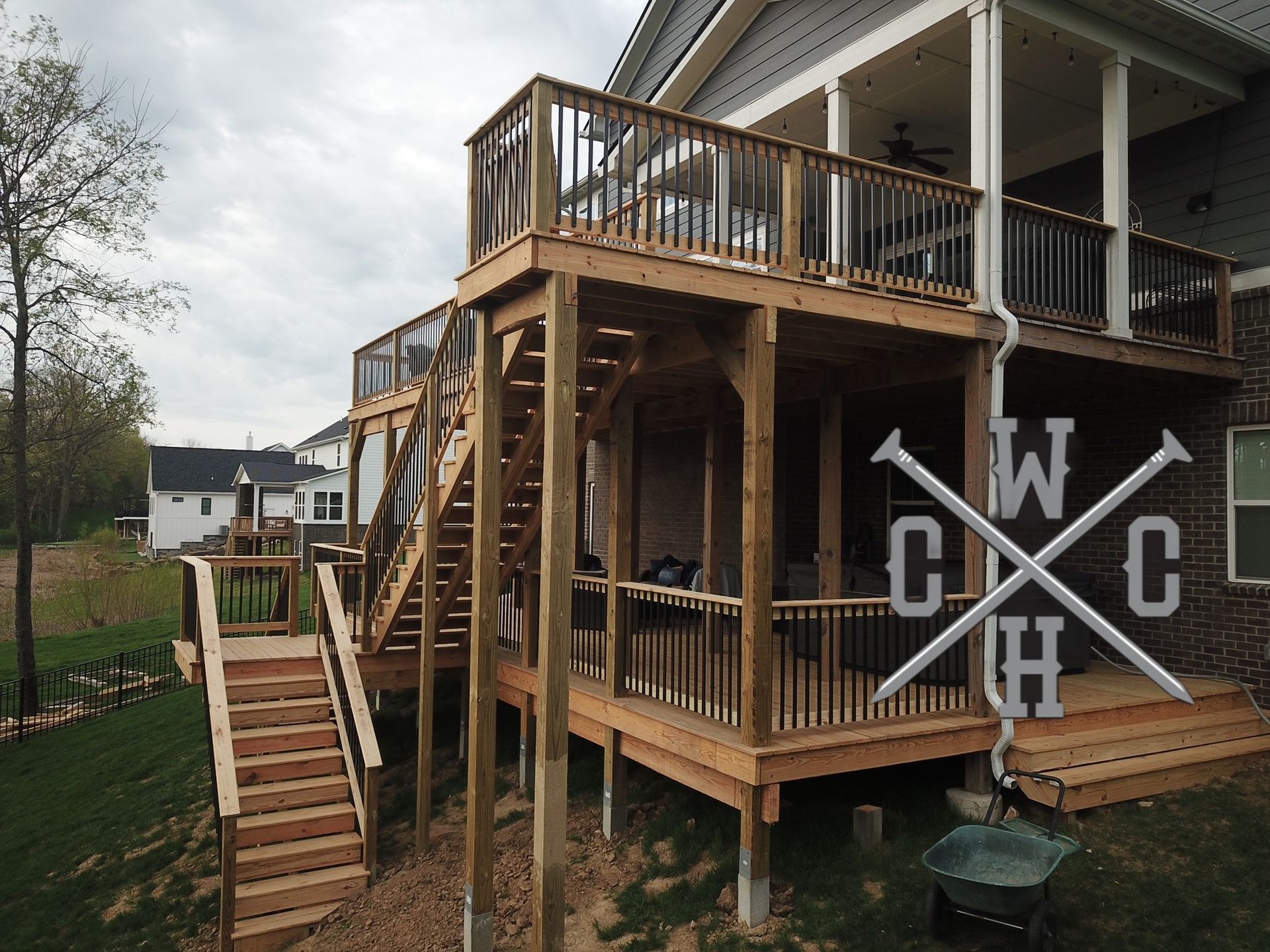 A large wooden deck with stairs leading up to it